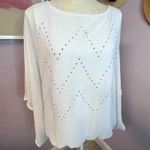 Bright White sheer blouse with chevron patter sparkly studs. Top is beautiful!